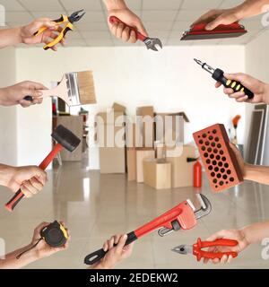Many hands with different construction tools indoors Stock Photo