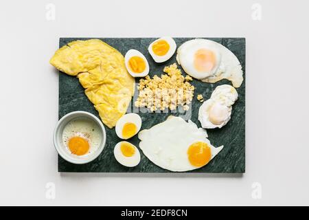 Set of different egg dishes on light background Stock Photo