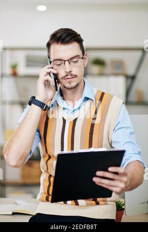 Serious businessman making phone call Stock Photo