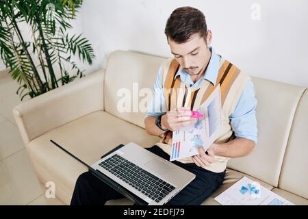 Analyst video calling colleagues Stock Photo