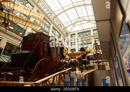 A historic mail carriage and airplane on display at the Smithsonian National Postal Museum in Washington, DC, USA. Stock Photo