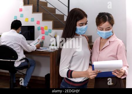 Business Team brainstorm meeting. Group of business people working at Private Home Office.Young business people working with laptop .Asian teamwork bu Stock Photo