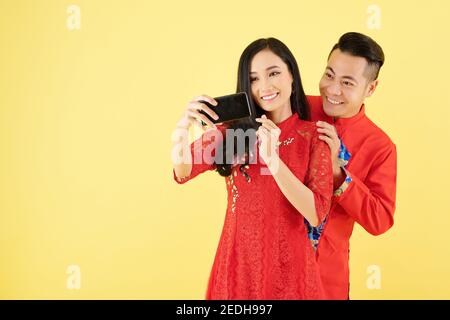 Vietnamese couple taking selfie Stock Photo