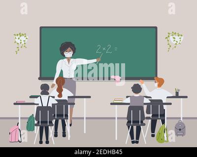 African female math teacher with medical mask explaining multiplication to elementary school pupils or children near chalkboard.Woman teaching Stock Photo