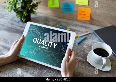 Quality control concept on device screen. Business and technology concept Stock Photo