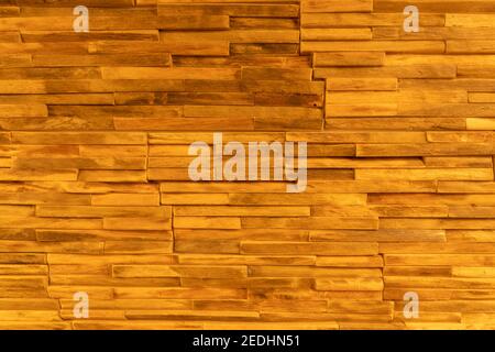 Wall cladding made from pieces of wood as background Stock Photo