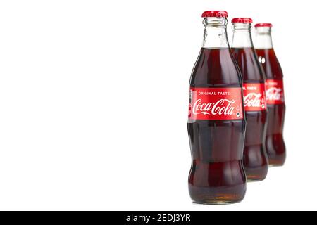 Estonia, Tallinn - 14.02.2021: Coca-Cola Classic in a glass bottle Isolated on white. Stock Photo