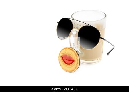 Portrait of a cute character made of a cappuccino glass, sunglasses and a cookie with red lips isolated on white. Stock Photo