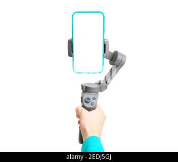 3-axis phone gimbal stabilizer in woman's hand isolated on white background.