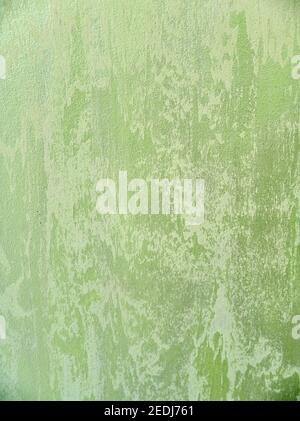 Light green and white gradient structure backdrop. Surface painted with textured plaster for modern interior repairing walls and ceilings with effect of natural stone. Stock Photo