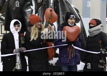 People take part in Women's Solidarity Chain, a rally in solidarity with political prisoners, by a monument to Russian poet Alexander Pushkin and his wife Natalia Goncharova. Photo by Milla Tcharoukh/bePress/ABACAPRESS.COM Stock Photo