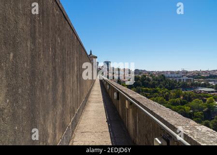 Walking path through viaduct across Lisbon aqueduct. Stock Photo