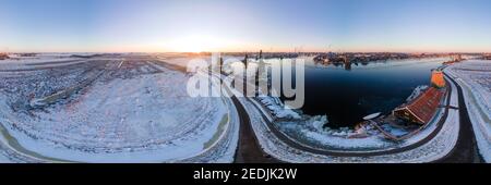 panoramic view over the Zaanse Schans windmill village snow covered during winter, Zaanse Schans wind mills historical wooden mills in the Netherlands. Europe Stock Photo