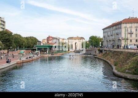 Milan,Italy-september 29,2020:People walk along the shore of the Naviglio Milanese canal and relax in the bars during the coronavirus pandemic (Covid- Stock Photo