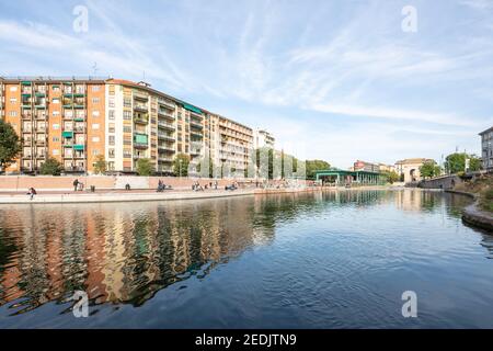 Milan,Italy-september 29,2020:People walk along the shore of the Naviglio Milanese canal and relax in the bars during the coronavirus pandemic (Covid- Stock Photo