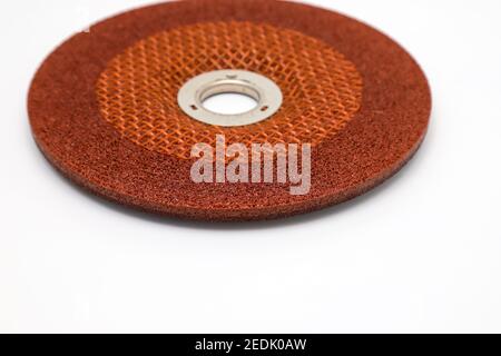 Abrasive wheel, grinding disc of orange, isolated on white background. Abrasive materials, discs, tools close-up Stock Photo