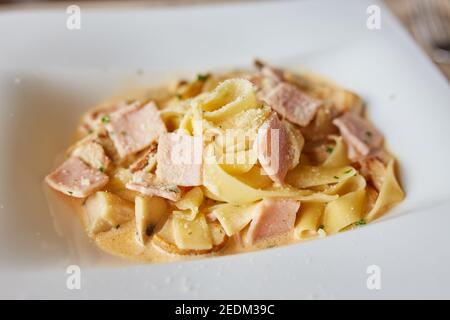 Carbonara paste. Tagliatelle with fried bacon. selective focus Stock Photo