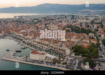 Aerial drone shot of Diocletian Palace by port riva in Split old town in Croatia in sunset Stock Photo