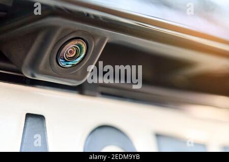 Luxury car rear view camera for parking assistance selective focus close up with sunflare and copyspace. Concept of safety car driving while parking Stock Photo