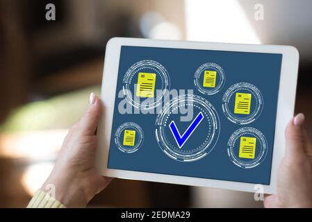Tablet screen displaying a document validation concept Stock Photo - Alamy