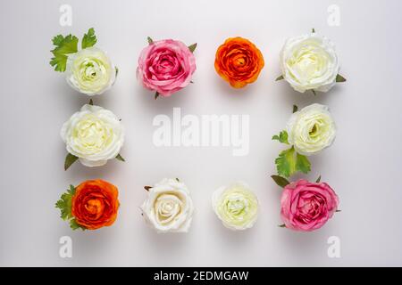 Creative layout of beautiful rose flowers on white background. Minimal holiday concept. Stock Photo