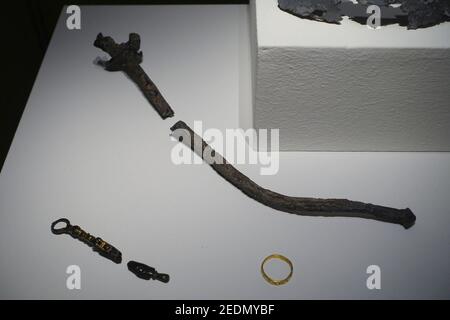 Objects from the grave of Lothair II, Holy Roman Emperor, lead scepter 1137 AD, gold ring 1100-1150 AD - Stock Photo