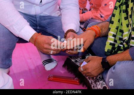 Indian groom in wedding wearing ring as traditional ceremony in Indian culture Stock Photo