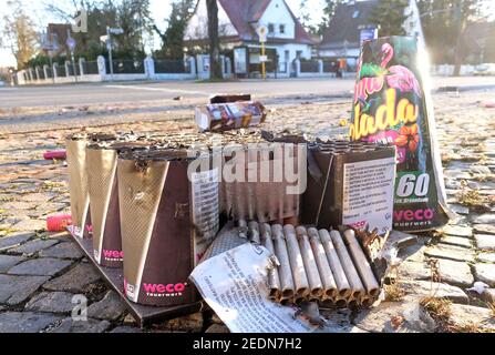 02.01.2020, Berlin, Saxony, Germany - Packages of New Year's Eve fireworks lie on a pavement.. 00S200102D296CAROEX.JPG [MODEL RELEASE: NO, PROPERTY RE Stock Photo