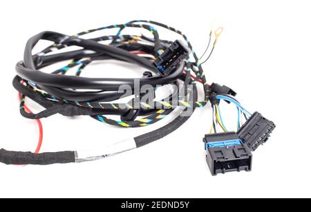 Braided automotive wiring with electrical connectors on white background, isolate. Close-up, equipment Stock Photo