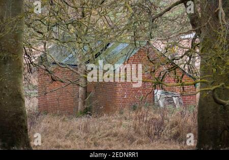 abandoned derelict brick building at a tank crossing on Salisbury Plain Wiltshire Stock Photo