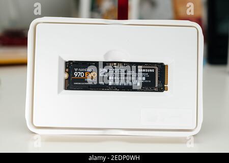 London, United Kingdom - Jan 18, 2019: Unboxing of new fast Samsung 970 EVO NVMe M2 1tb disk drive in plastic package Stock Photo