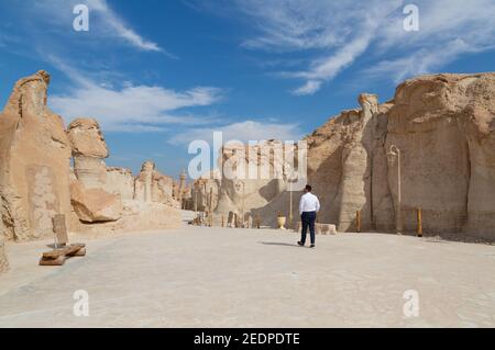 Lonely male tourist at Al Qarah Mountain in Eastern province of Saudi Arabia Stock Photo