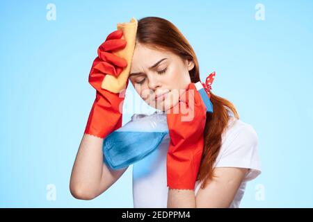 cleaning lady with detergent in hand housework professional service Stock Photo