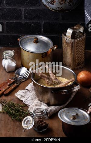 Stewed rabbit legs with sour cream Stock Photo