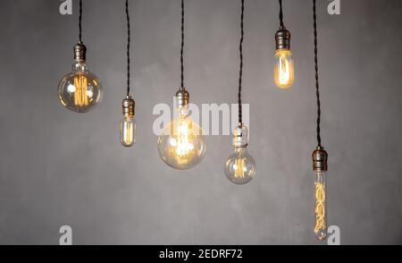 Set edison retro lamp on loft gray concrete background. Concept idea. Stock Photo