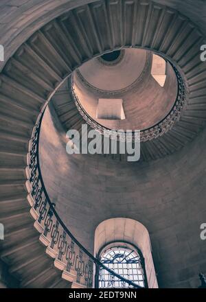 The Dean's Staircase, St Paul's Cathedral, view up spiral stairs made famous as the Divination Stairwell in the Harry Potter films, London UK Stock Photo