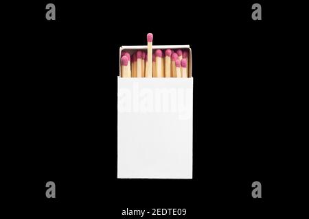 Close-up of an opened matchbox with matches isolated on black background. Stock Photo