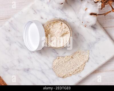 Natural body scrub on marble background. Cosmetic face cream Stock Photo