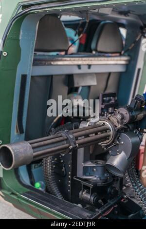 Closeup of a powerful rapid fire heavy machine gun with ammunition Stock Photo