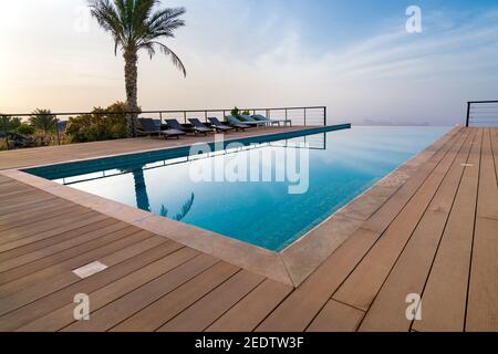 Infinity pool in a resort of arabian desert. Luxury resort in Oman. Stock Photo