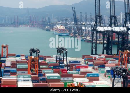 Aerial view of containers stacked at the Container terminal of Kwai Tsing, Kwai Chung, Lai Chi Kok stored until the loading and transfer from ships to trucks in Hong Kong, SAR, China. © Time-Snaps Stock Photo