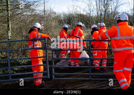 Wendover, Buckinghamshire, UK. 15th February, 2021. HS2 confiscate personal property belonging to an activist. HS2 Ltd have this morning fenced off a public footpath and started fencing off an area of woodland known as the Spinney in readiness to fell numerous mature trees as part of the High Speed 2 rail link from London to Birmingham. The landowner was allegedly not notified by HS2 Ltd in advance. National Eviction Team (NET) bailiffs working for HS2 were on site as were a large number of police who were using a drone above the woods. Anti HS2 activists are living in the woods nearby in an a Stock Photo