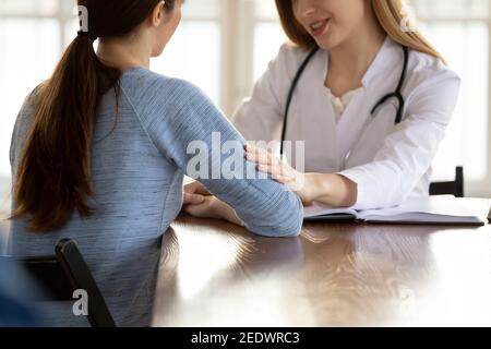 Supportive young doctor giving psychological help to patient. Stock Photo