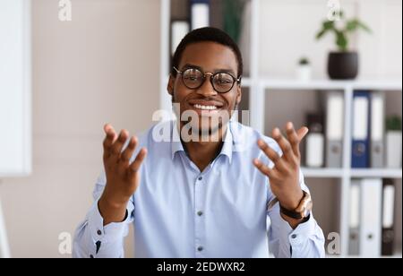 Portrait of african american business coach talking and gesturing Stock Photo