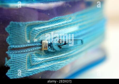 Zipper Close Up detail light blue zipper, a carrying case school Stock Photo