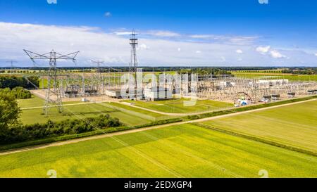Modern high voltage transformation power station for electrical Industry with many transformers, isolators and lines. Stock Photo