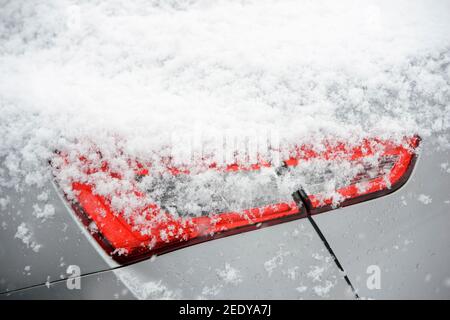 Close up of snow on a car's rear light cluster. Stock Photo