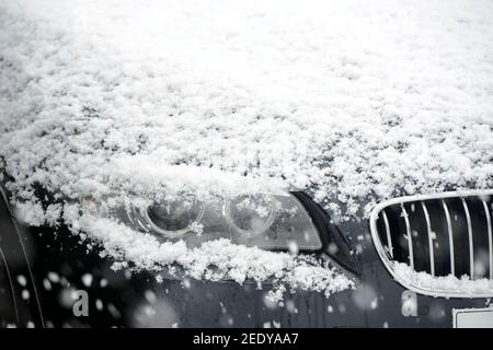Snow lying on the bonnet of a BMW car. Stock Photo