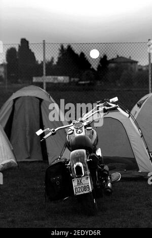 PARMA, ITALY - Sep 02, 2007: Black and Withe vertical photo of motorcycles in front of the tents Stock Photo