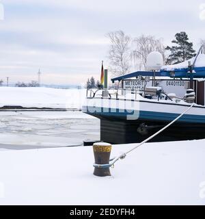 The barge Meteorit during a forced break in winter in front of the Rothensee sluice area near Magdeburg Stock Photo